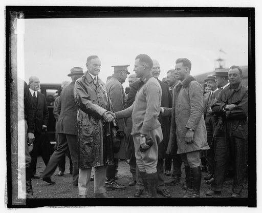 Pres. Coolidge & Sec. Weeks with W[orld] Flyers