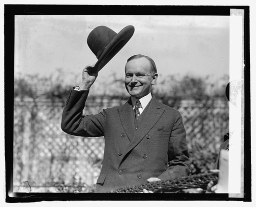 Pres. Coolidge with hat presented by Smoki Tribe