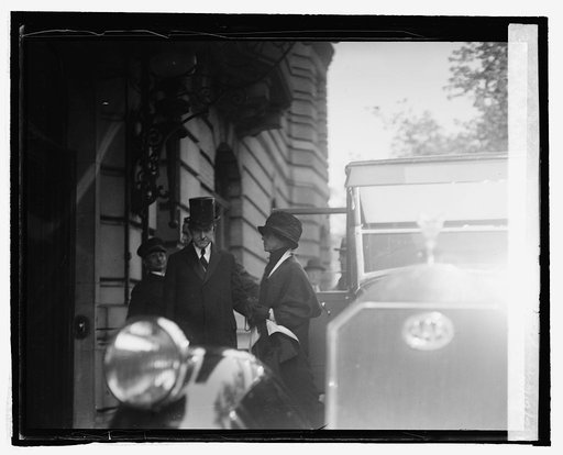 Pres. & Mrs. Coolidge leaving home of Justice Jos. McKenna after funeral, 10/13/24