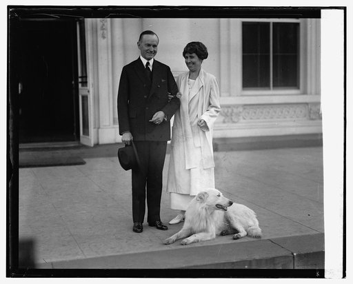 Pres. & Mrs. Coolidge acknowledge greetings from crowd, 11/5/24