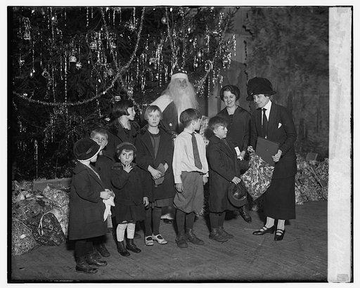 Mrs. Coolidge distributing baskets of clothes for Central U. Mission, 12/24/24