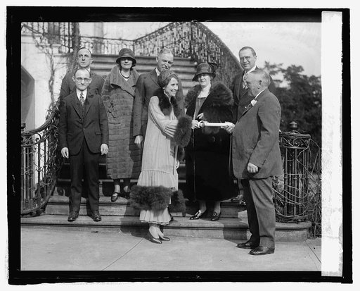 Fur dealers of Vermont present Mrs. Coolidge with coat, 3/9/25