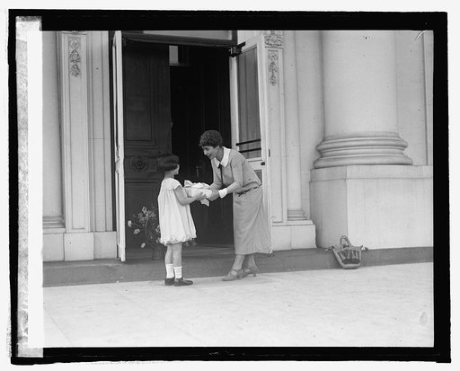 Peggy Kahn presents Mrs. Coolidge with cake, 5/1/25