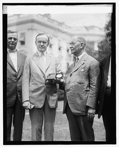 W.T. Galliher presents Coolidge with inaugural medallion, 6/19/25