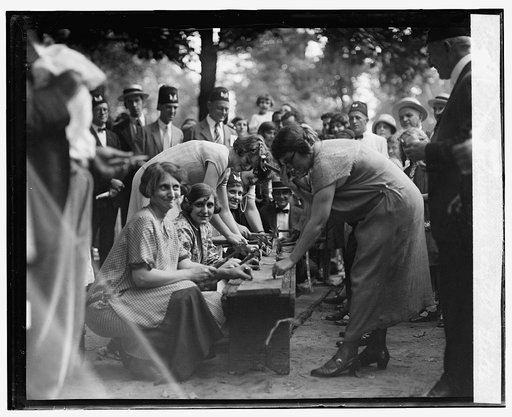 Nail driving contest, Grotto
