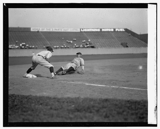 Yankees Babe Ruth out in fifth inning trying to go from first to third on Lou Gehrig's single. Senators third baseman is Ossie Bluege. Yankees won 3-2, at Griffith Stadium, Washington, D.C.