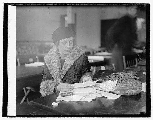 Mrs. William Mitchell opening mail for the Colonel, 10/30/25