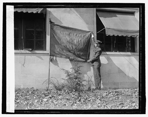 Howard S. Fisk with flag of Geo. Wash. Post, Amer. Legion, [10/20/25