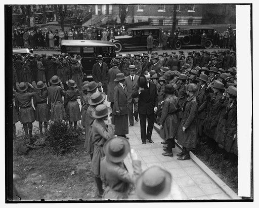 Pres. & Mrs. Coolidge at girl scout little house, 11/7/25