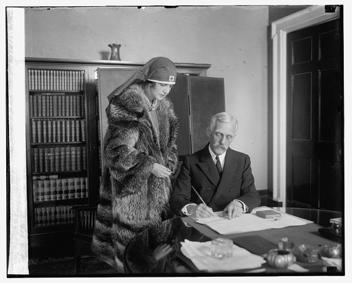 Miss Virginia Seldon enrolling Sec. Mellon in Red Cross, 11/18/25