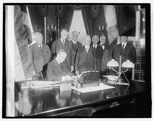 Coolidge signing tax bill, 2/26/26
