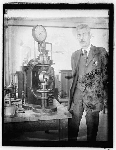 Capt. S.N. Petrenko with calibration testing device (Bu. of Stds.), 3/19/26