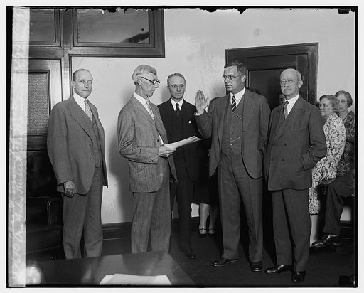 Chas. P. Sisson taking oath, Sen. Felix Herbert, Chas. P. Sorenborger, Mitchell, Jas. H. Metcalf, 6/11/29