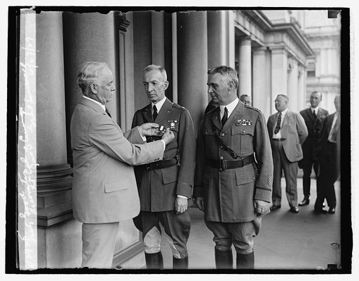 Secty. Good decorates Lt. Col. Jas. G. Cummings, Genl. Summerall, 6/27/29
