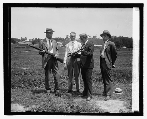 Genl. Geo. F. Simmons inspecting new rifile, 7/2/29