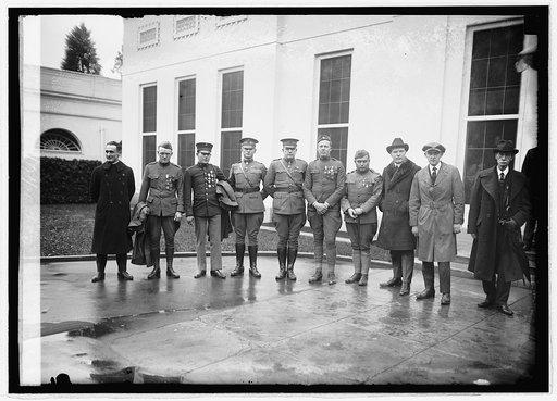 Unidentified group of men in uniform outside White House], 11/14/21