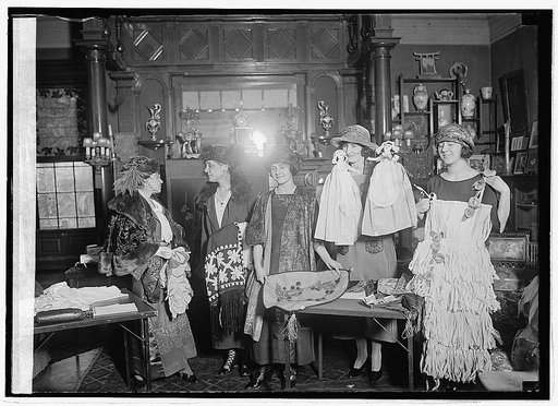 Women with display of textiles, etc.] 2/9/23