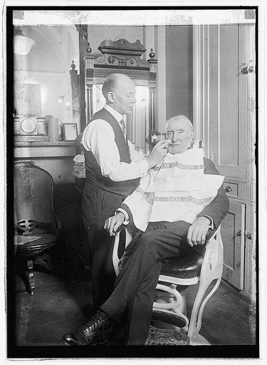 Joe Cameron being shaved, 1923