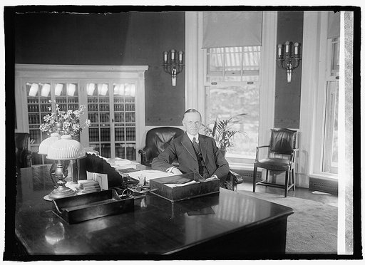 Coolidge at desk in White House, [8/14/23