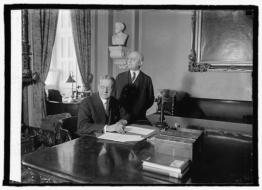 Sen. Geo. H. Moses (sitting), Geo. A. Sanderson, Secty. of Senate (standing), 3/25/24