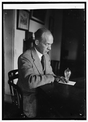 Carl. W. Mitman Curator of engineering at Smithsonian Institution with 1st cold electric light bulb, 9/6/24