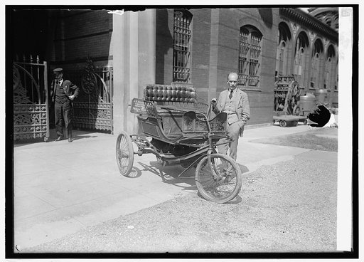 Carl. W. Mitman, Curator of Smithsonian Institution with 3-wheeled auto, 9/6/24