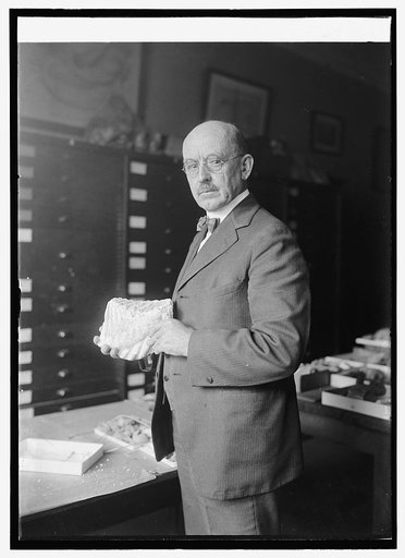 Dr. J.W. Gidley of Smithsonian Institute with tooth of extinct elephant, 10/6/24