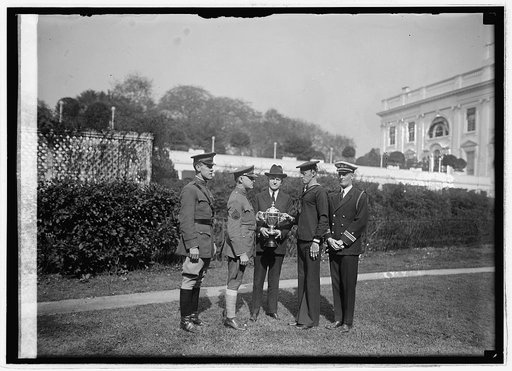 Maj. Paul Baade, Serg. H.O. Troupe, Coolidge, Cox, C.A. Ezell, Lt. Com. H.V. Bryan, [10/18/24