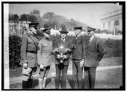 Maj. Paul Baade, Serg. H.O. Troupe, Coolidge, Cox, C.A. Ezell, Lt. Com. H.V. Bryan, 10/18/24