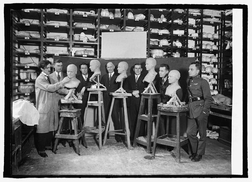 Round the World Fliers pose beside their busts, 12/9/24