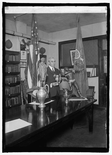 Col. J.H. Hughes, V.S.A., with trophies won by the infantry, 1/12/25