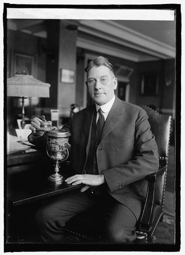 Sec. Wilbur with trophy presented by China to American battleship fleet, 1908, 1/12/25