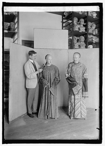 W.H. Egberts of Nat'l. Museum with gowns of Emperor and Empress of China, 2/20/25