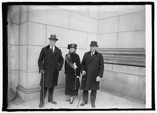 Sec. Hughes with Amb. & Mrs. Kellogg on arrival at Union Station, [Washington, D.C.], 2/26/25