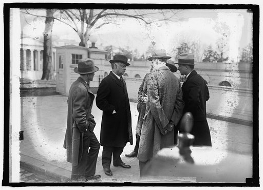 Senator Curtis with newspapermen at W.H. [i.e., White House, Washington, D.C.], 3/12/25