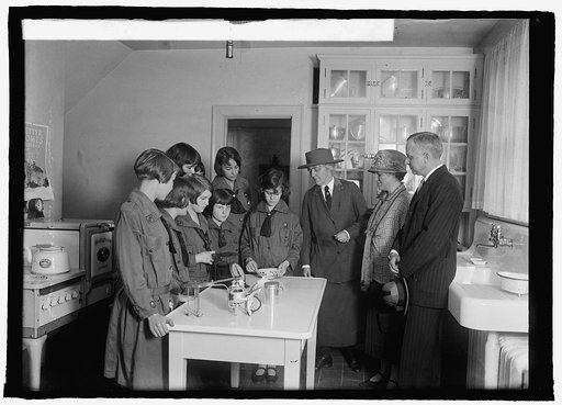 Mrs. Herbert Hoover & Dr. and Mrs. James Ford at Girl Scouts' little house, 5/16/25