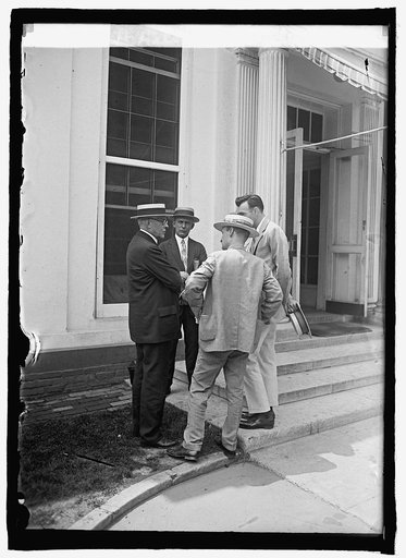 R.T.H. Halsey with newspapermen, 7/8/25