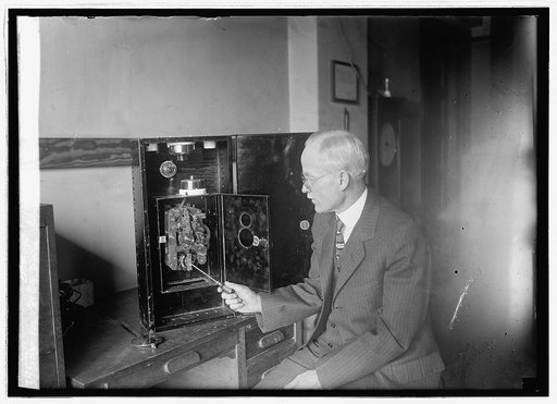 Dr. J.C. Van Slyke with electric clock, 3/15/26