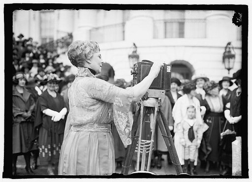 Florence Kling Harding operating a movie camera on the lawn of the White House, Washington, D.C.] 4/8/22