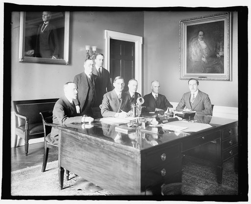 Signing of Russian War Loan, 1917. Shown: Constantine Onou, Russian Embassy; Frank L. Polk; Serge Ughet, Russian Embassy; Sec. McAdoo
