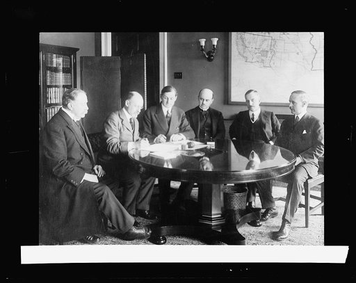 Signing the British War Loan, 1917. L. To R.: Lord Canliffe; Sir Cecil Spring-Rice, British Ambassador; Sec. McAdoo; Sir Hardman Lever; Sir Richard Crawford; Asst. Sec. Crosby