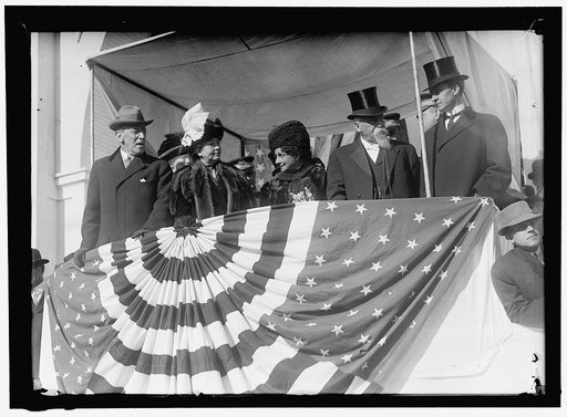 Woodrow Wilson and wife Ellen with unidentified on viewing stand