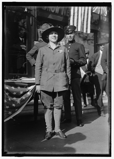 Dora Rodrigues, recruiter for service branches, possibly in front of the Cosmos Theater, Pennsylvania Avenue, Washington in May 1917