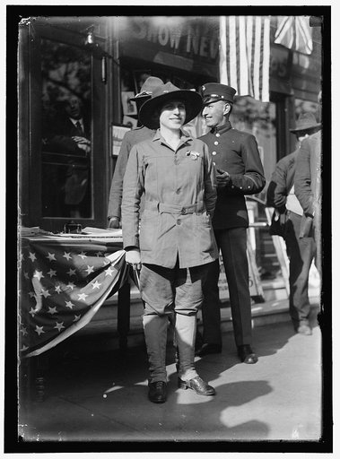 Dora Rodrigues, recruiter for service branches, possibly in front of the Cosmos Theater, Pennsylvania Avenue, Washington in May 1917