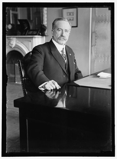 John Skelton Williams at desk