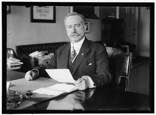 John Skelton Williams at desk