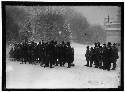 Group outside White House in snow
