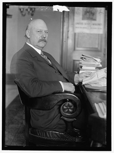 John W. Weeks at desk