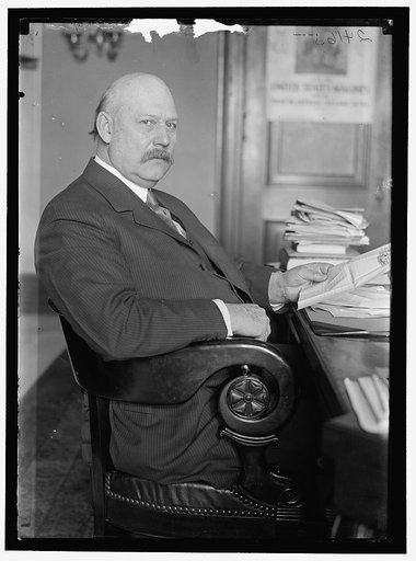 John W. Weeks at desk