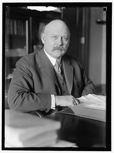 John W. Weeks at desk